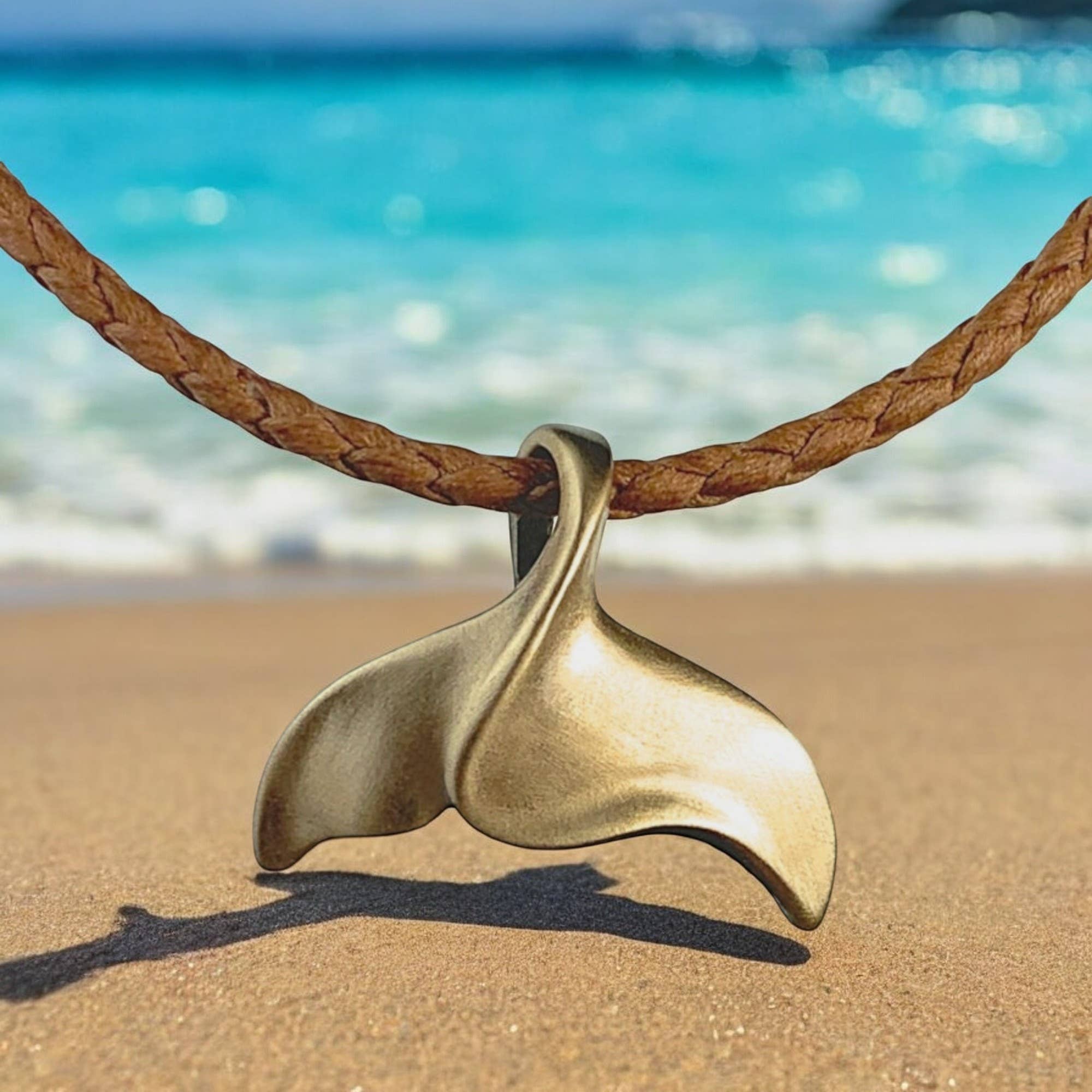 Roland St John whale tail bronze necklace pendant and chain detail