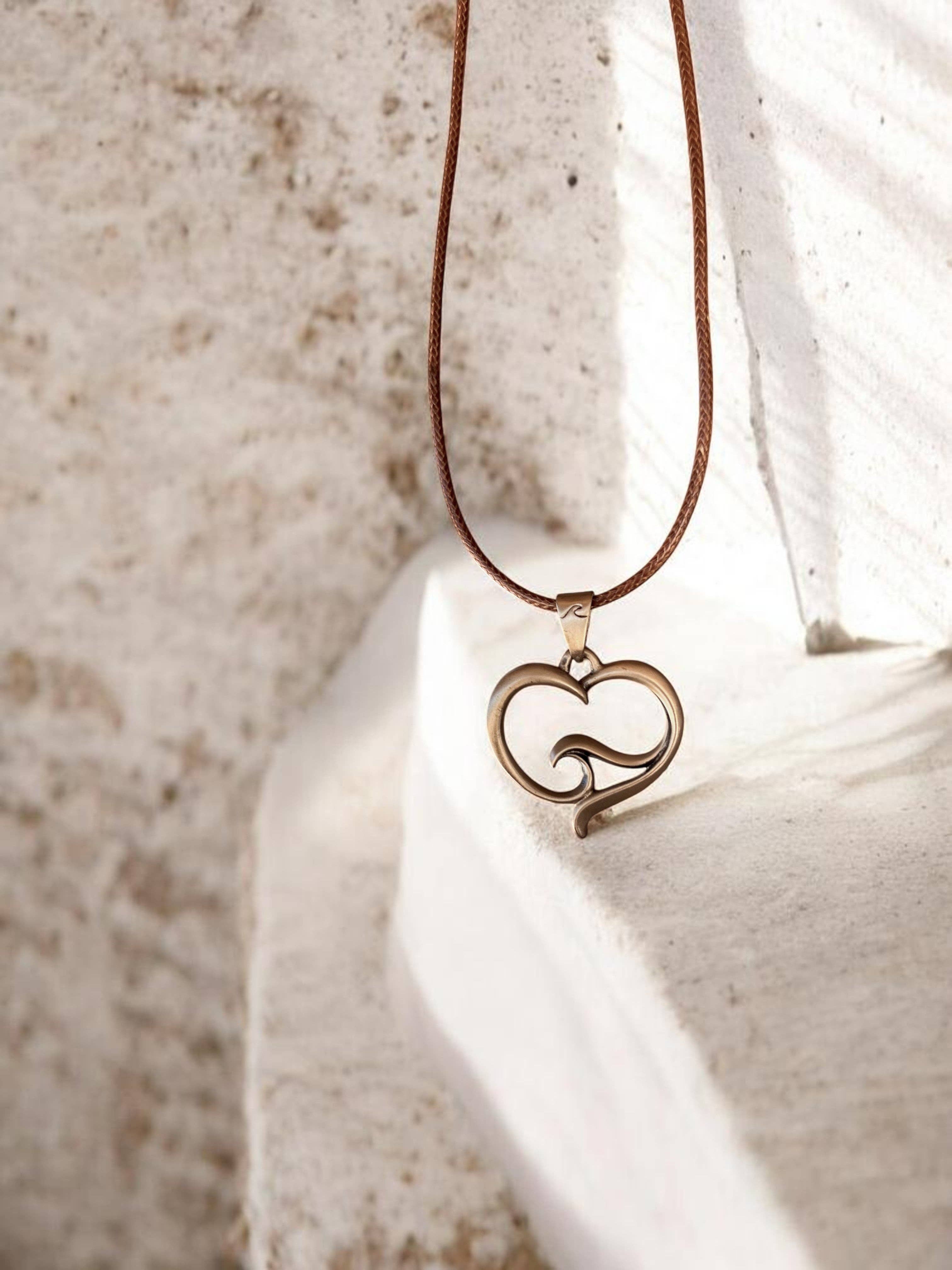 Roland St John ocean wave heart bronze pendant close-up